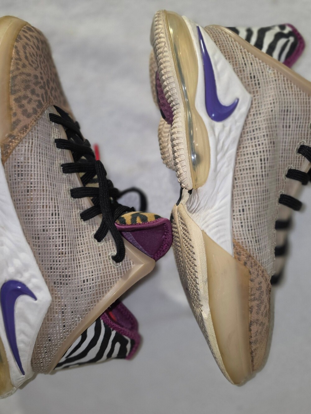 The shoes featured in the image are the Nike LeBron 19 Low "Safari"
